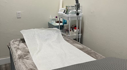 Treatment room at Silklash Nbrow in Costa Mesa, California, US, with a prepared bed and beauty tools.