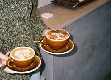 Two cups of latte art at Aurenda Coffee Co, Kings Beach, Queensland, AU.