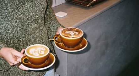 Two cups of latte art at Aurenda Coffee Co, Kings Beach, Queensland, AU.
