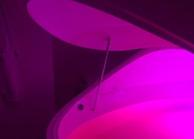 Illuminated float pod at W Wellness Centre in Bungendore, New South Wales, AU, offering serene relaxation.