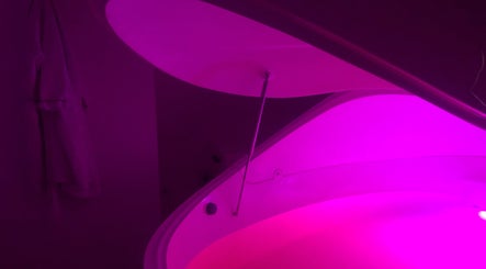 Illuminated float pod at W Wellness Centre in Bungendore, New South Wales, AU, offering serene relaxation.