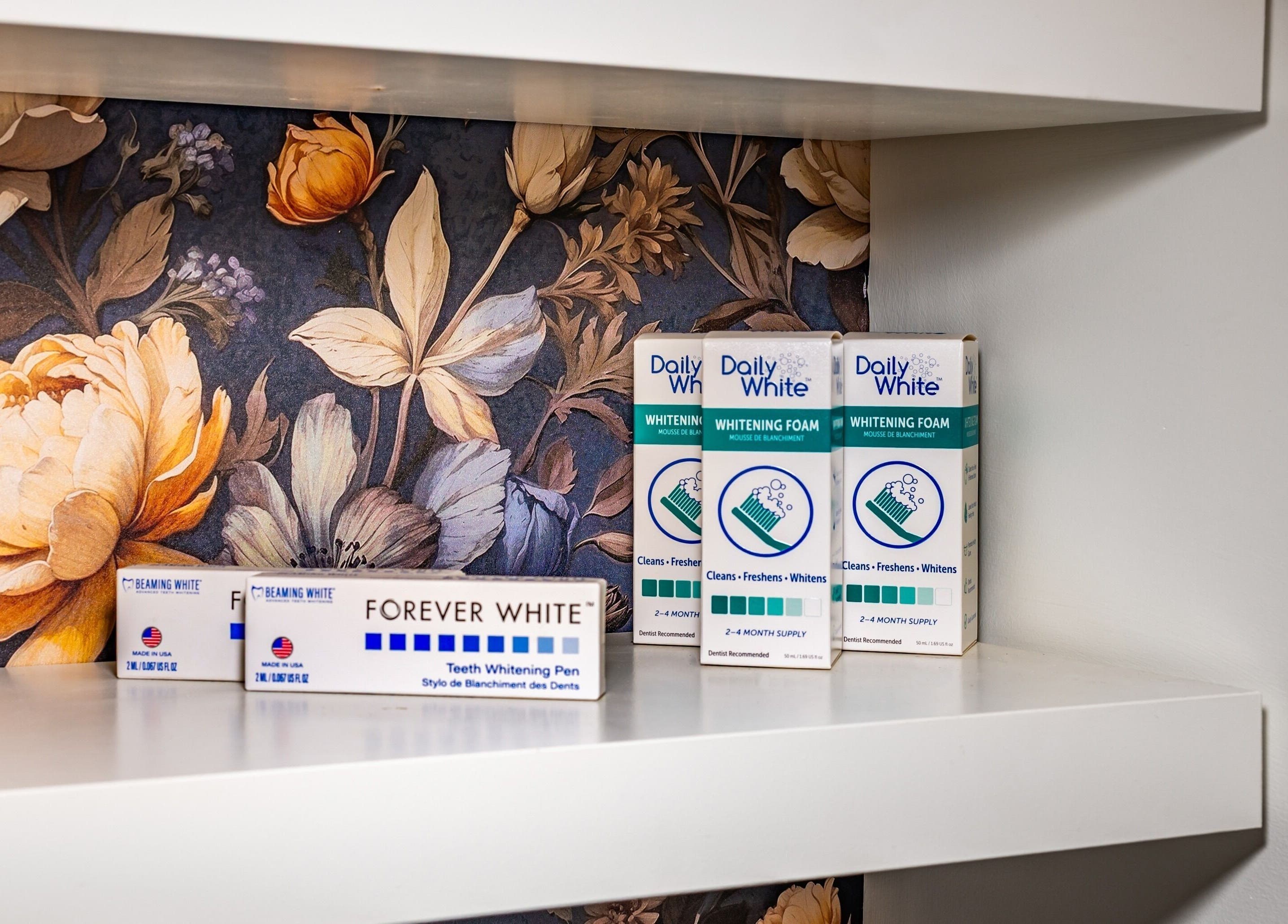Teeth whitening products at Confidents Teeth Whitening, Calgary, Alberta, CA on floral shelf.