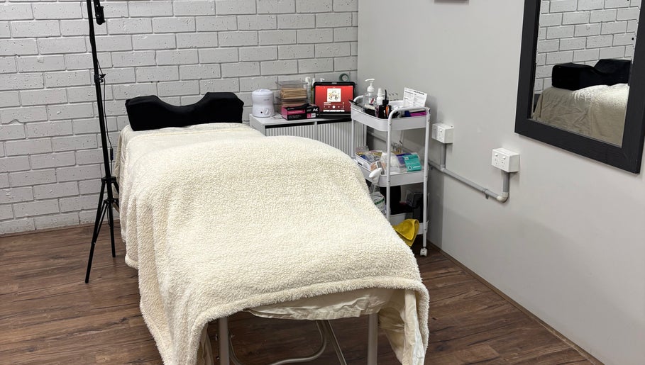 Cozy treatment room at Ethereal Beauty Therapy in Christies Beach, South Australia, AU, featuring a plush massage table.