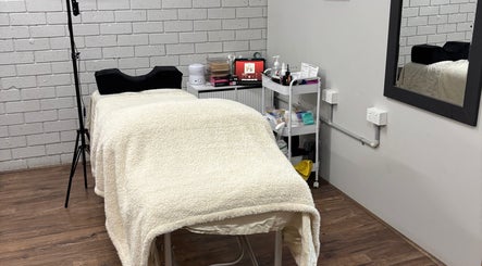 Cozy treatment room at Ethereal Beauty Therapy in Christies Beach, South Australia, AU, featuring a plush massage table.