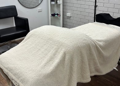 Tranquil treatment room at Ethereal Beauty Therapy, Christies Beach, South Australia, AU with cozy therapy bed.