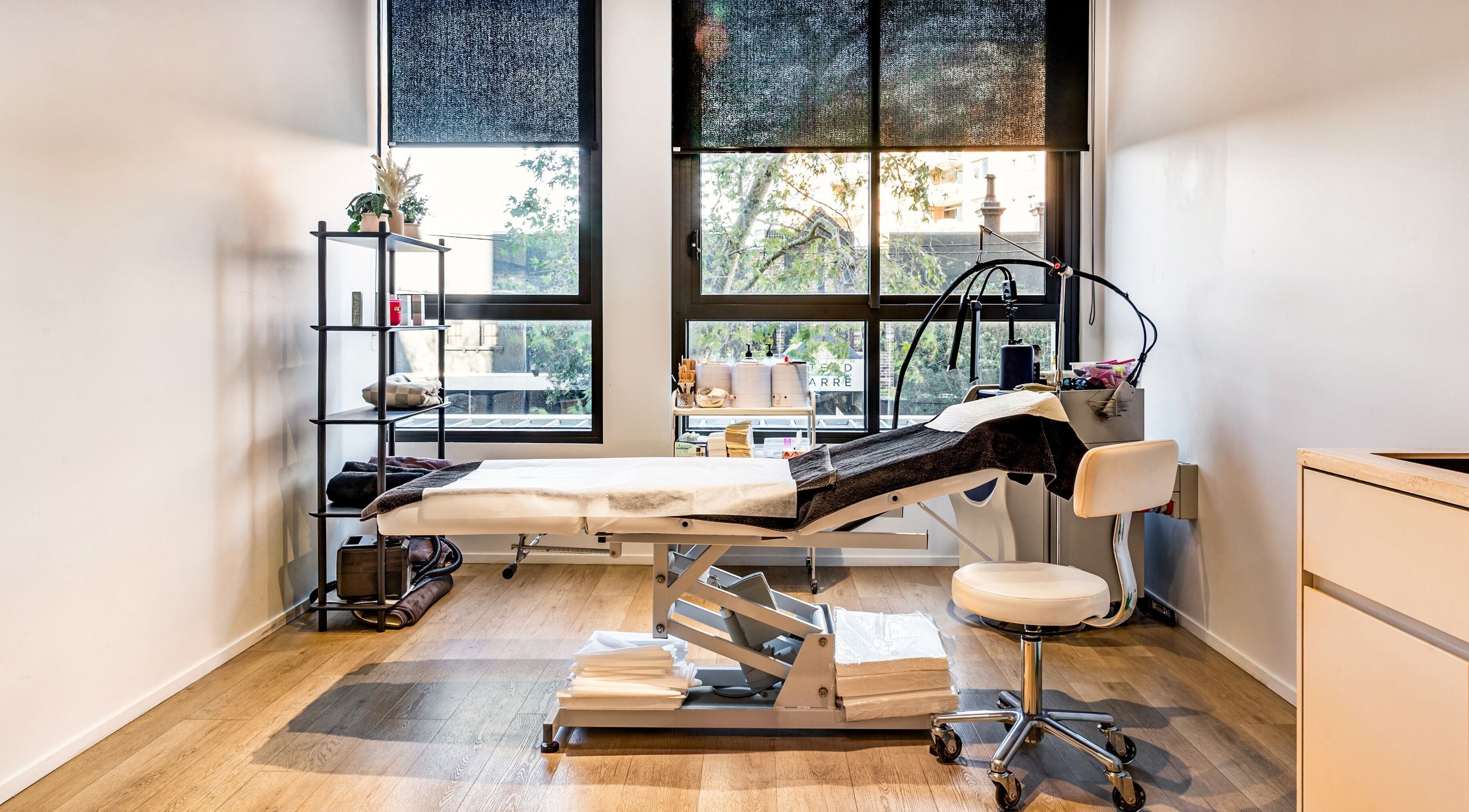 Tranquil treatment room at HoneySpot Beauty Room, Bondi Junction, New South Wales, AU with modern equipment.