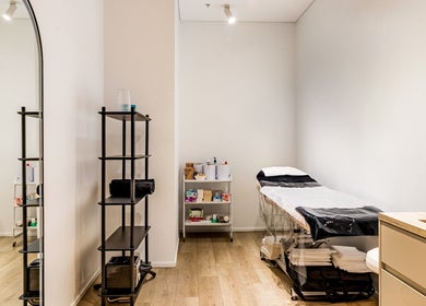 Calming treatment room at HoneySpot Beauty Room, Bondi Junction, New South Wales, AU with a massage table.