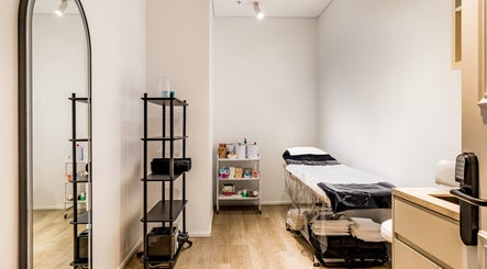 Calming treatment room at HoneySpot Beauty Room, Bondi Junction, New South Wales, AU with a massage table.