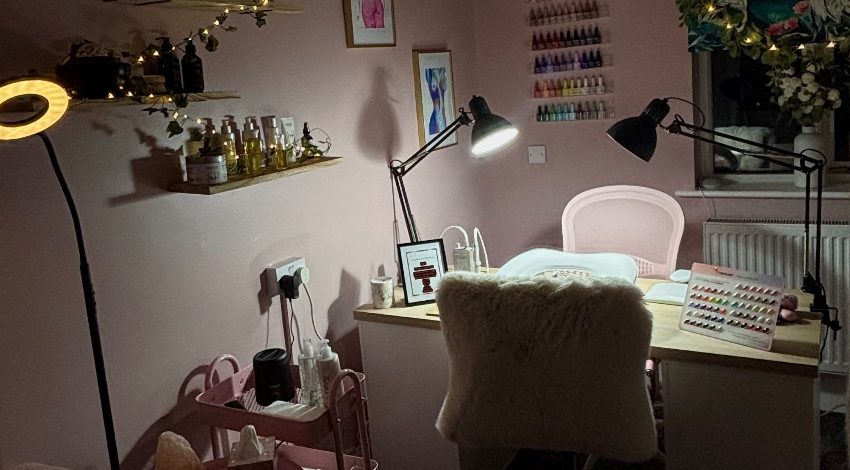 The Rose Room in Rugby, England, GB features a chic nail setup with plush seating and ambient lighting.