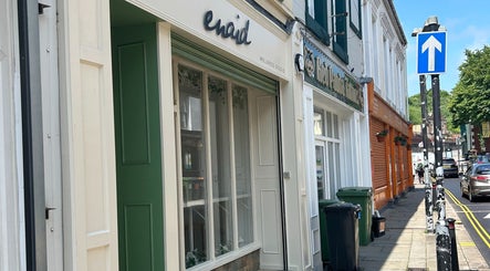 Elegant shopfront of J Burgess Sports Therapy, set in the vibrant street of Merthyr Tydfil, Wales, GB.