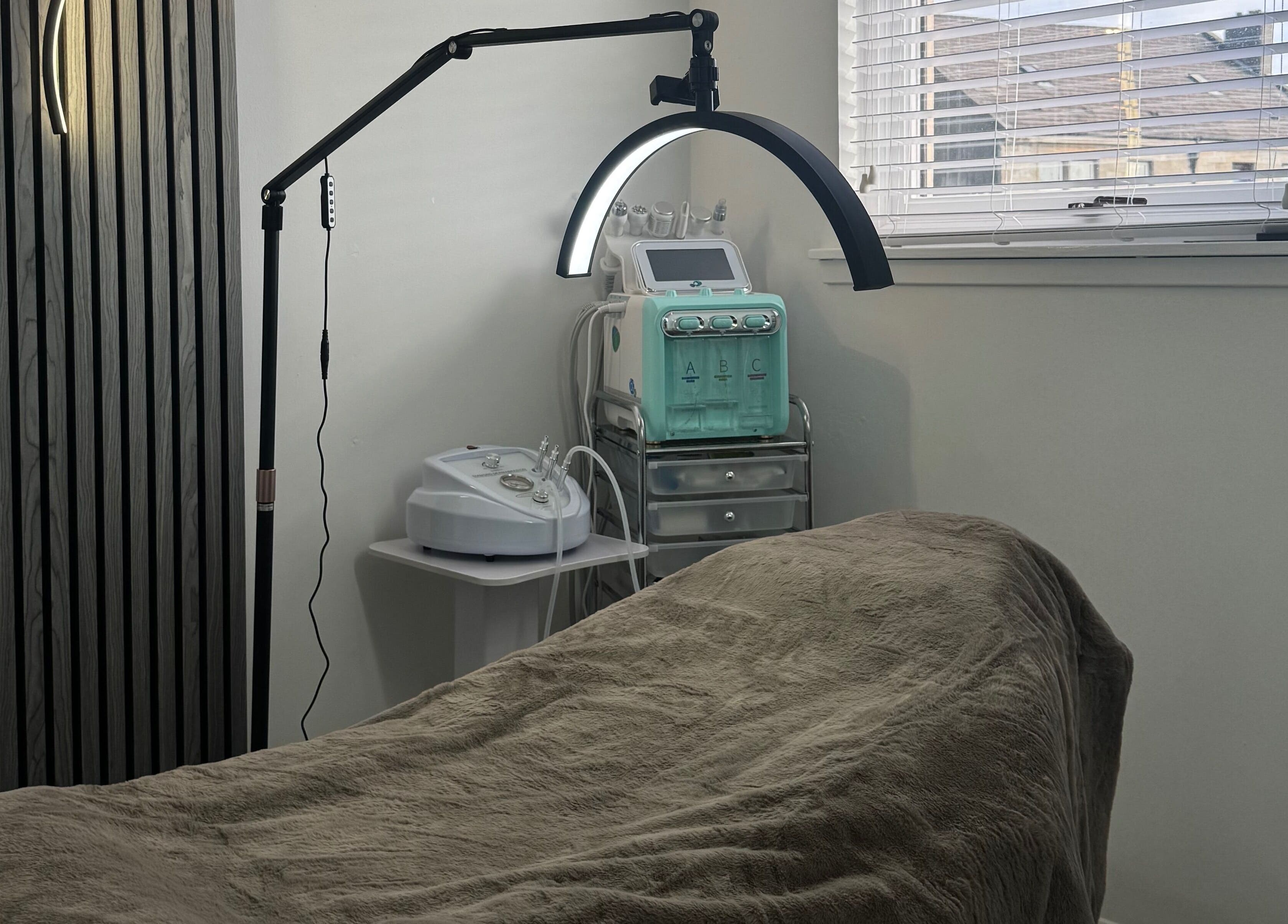 Serene skincare treatment room at More Than Skin By Diane, Hamilton, Scotland, GB, featuring modern equipment.