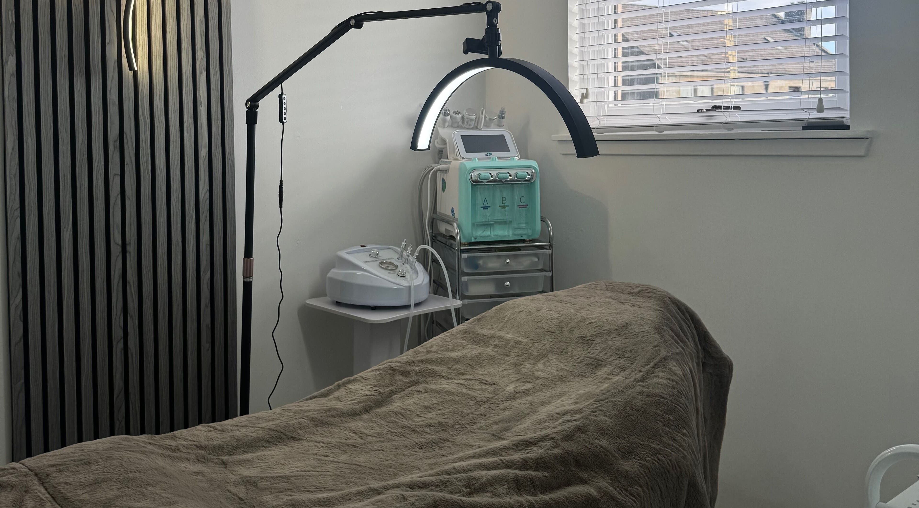 Serene skincare treatment room at More Than Skin By Diane, Hamilton, Scotland, GB, featuring modern equipment.