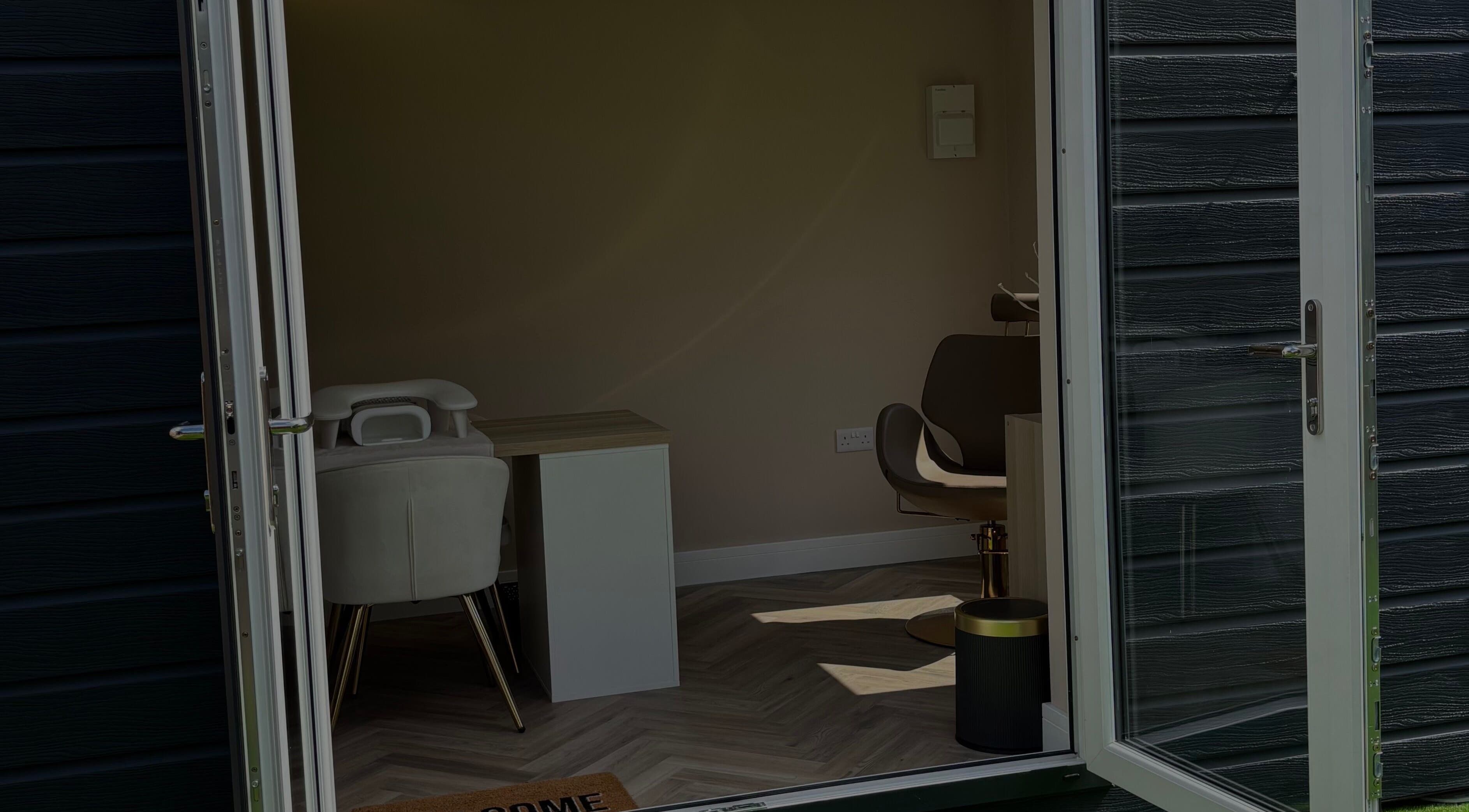 Entrance to By Jessie's cozy treatment room in Rumney, Wales, GB, showcasing chic interior design.