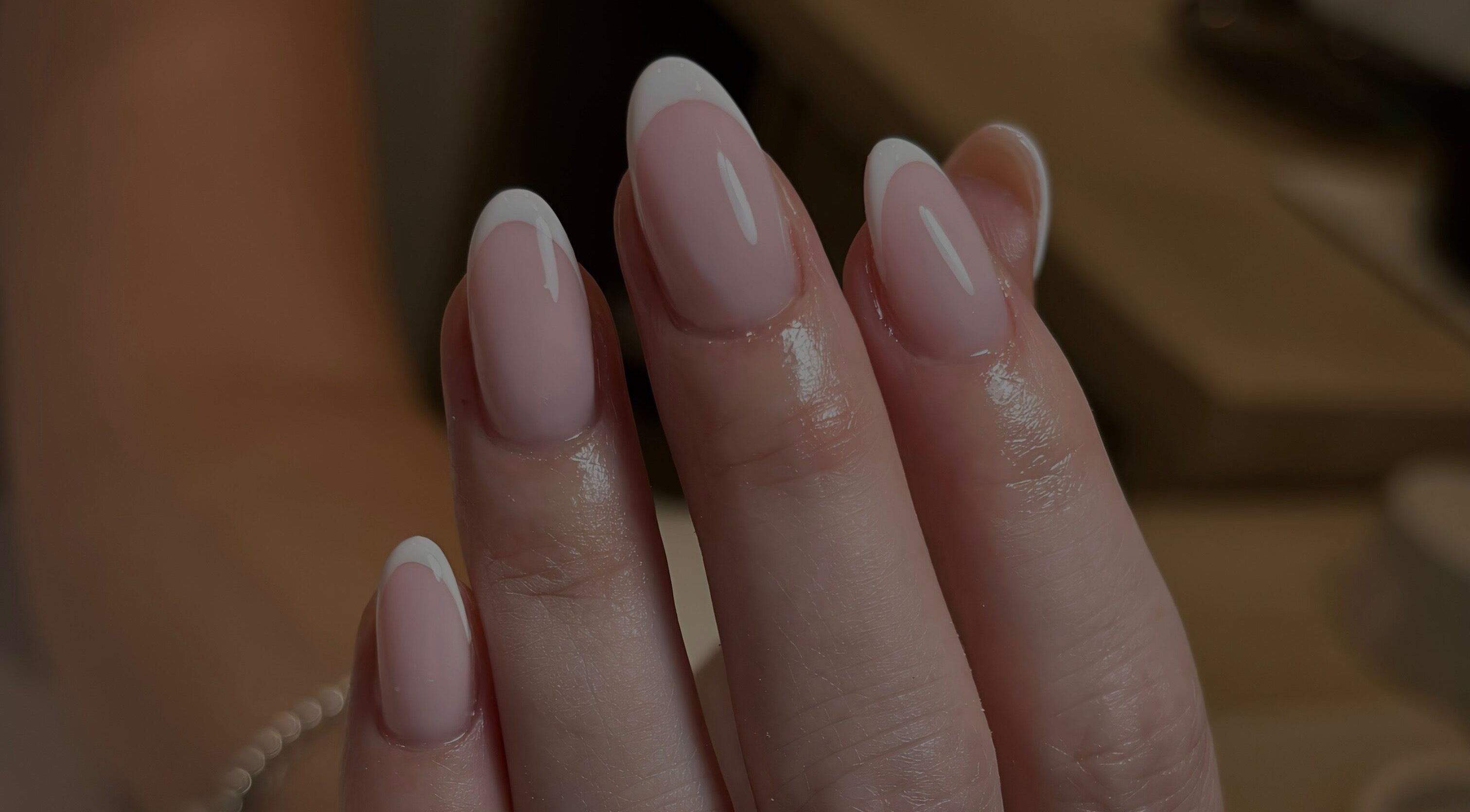 Elegant French manicure at By Jessie, Rumney, Wales, GB showcasing glossy, perfectly shaped nails.