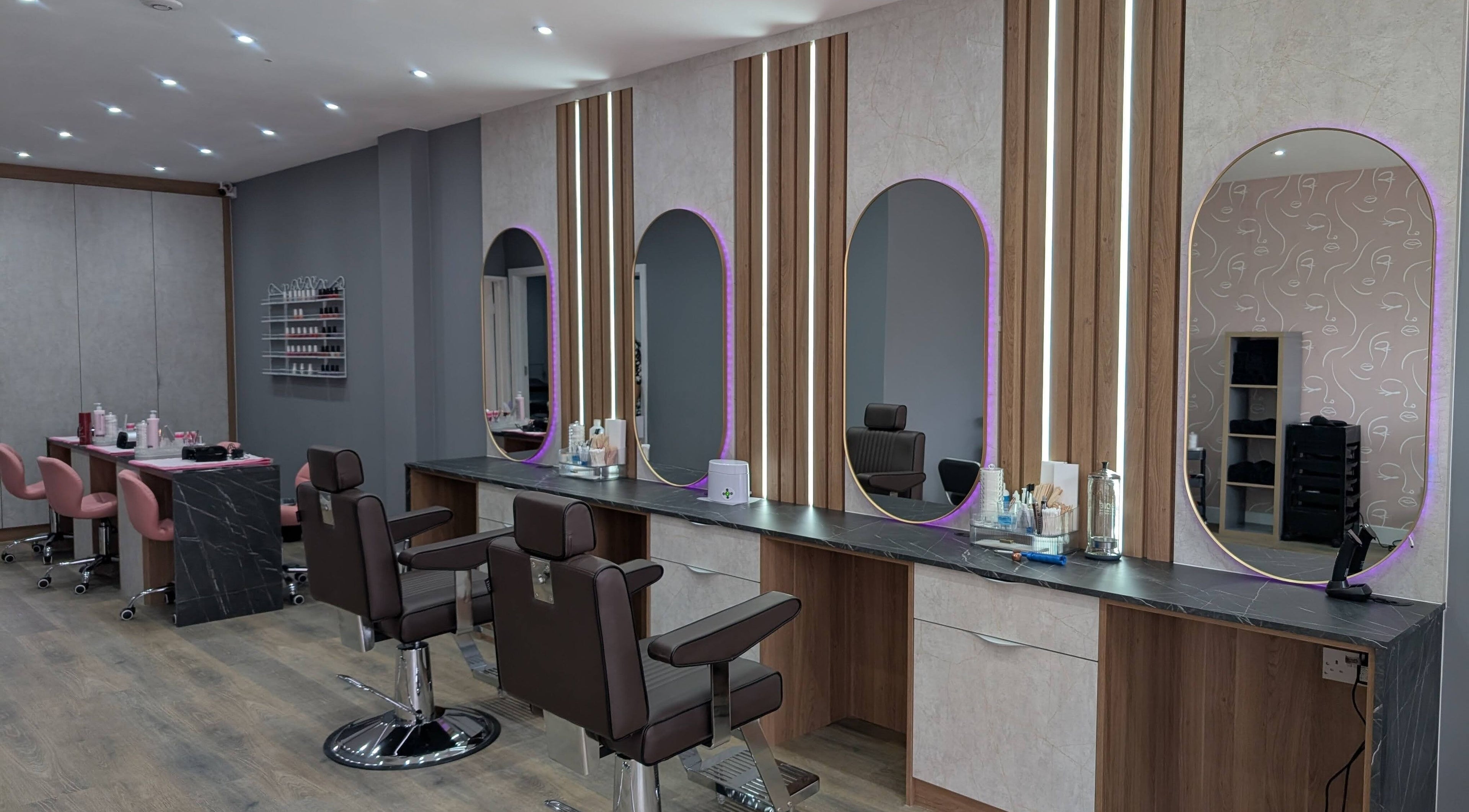 Elegant salon interior at Glowfinity - Woodley, featuring stylish mirrors and chairs in Woodley, England, GB.