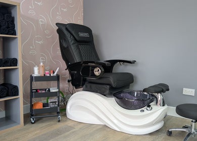 Luxurious pedicure chair at Glowfinity - Woodley in Woodley, England, GB, showcasing a stylish and comfortable setup.