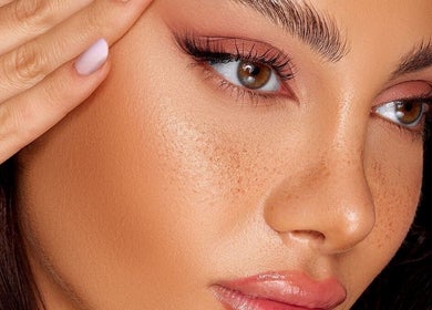 Close-up of a woman's luminous face showcasing makeup at GLAMBY GIA in Melbourne, Victoria, AU.