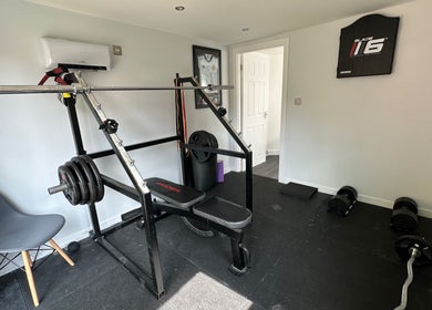 Workout equipment at Deaconsbank Physiotherapy in Glasgow, Scotland, GB, showcasing a well-equipped gym area.