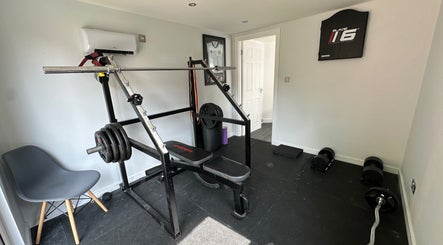 Workout equipment at Deaconsbank Physiotherapy in Glasgow, Scotland, GB, showcasing a well-equipped gym area.