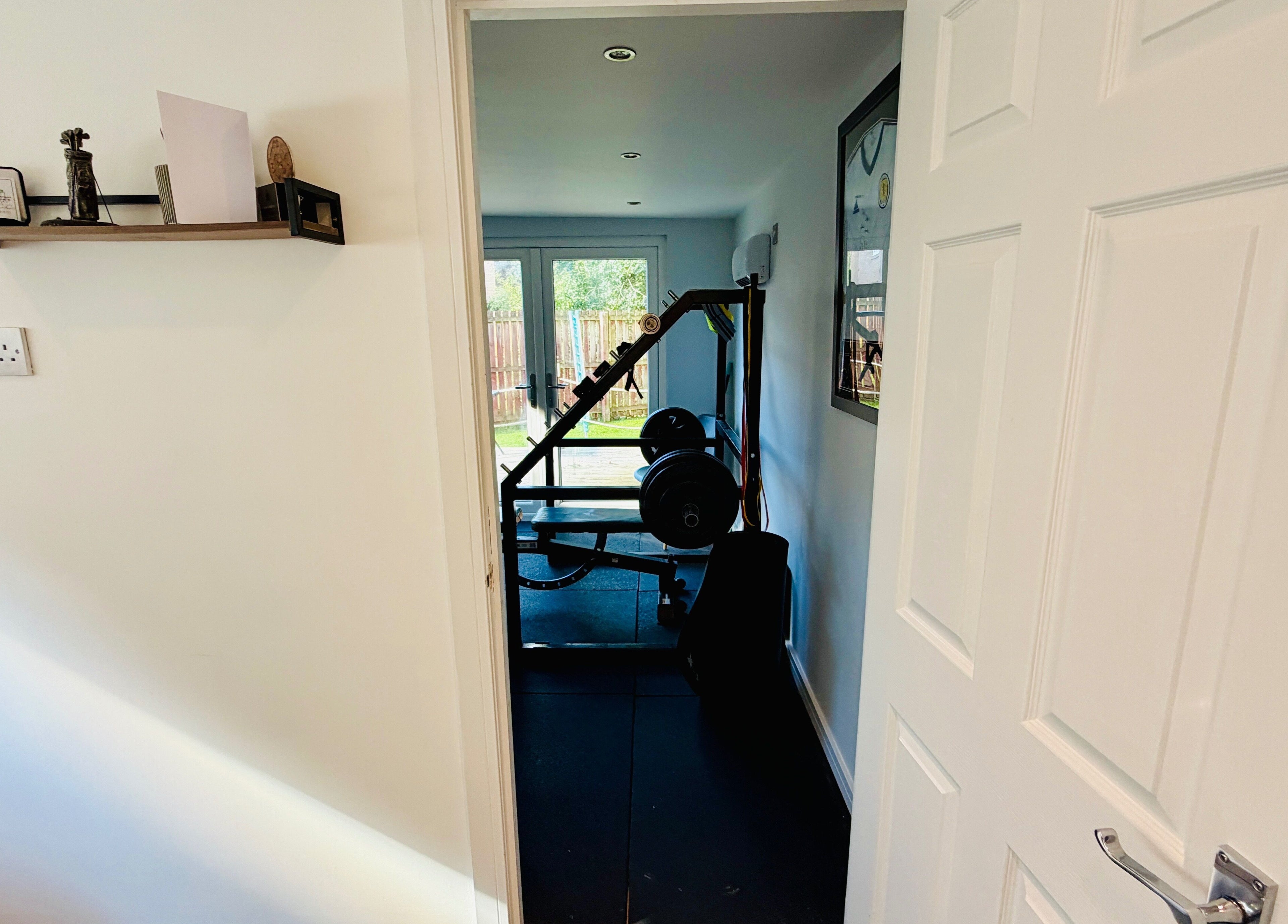 Entrance view of fitness room at Deaconsbank Physiotherapy, Glasgow, Scotland, GB with gym equipment.