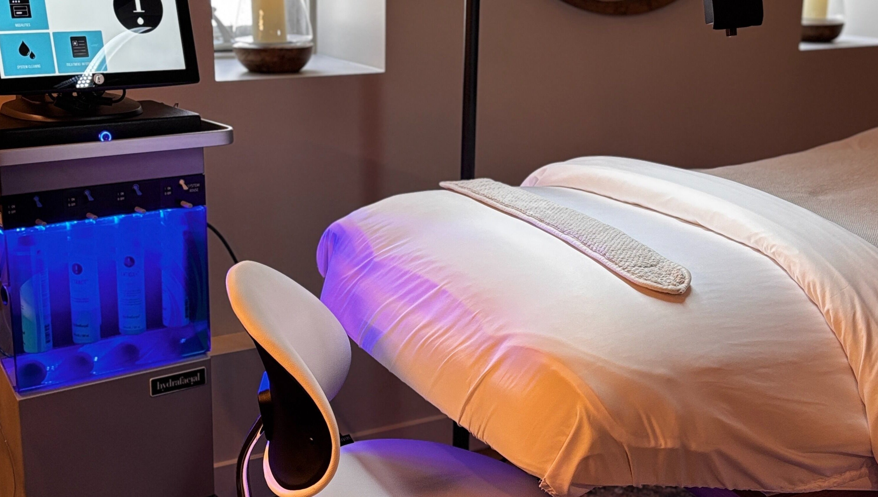 Relaxing spa treatment room at La Luma Spa & Aesthetics in Drumheller, Alberta, CA with a modern setup.