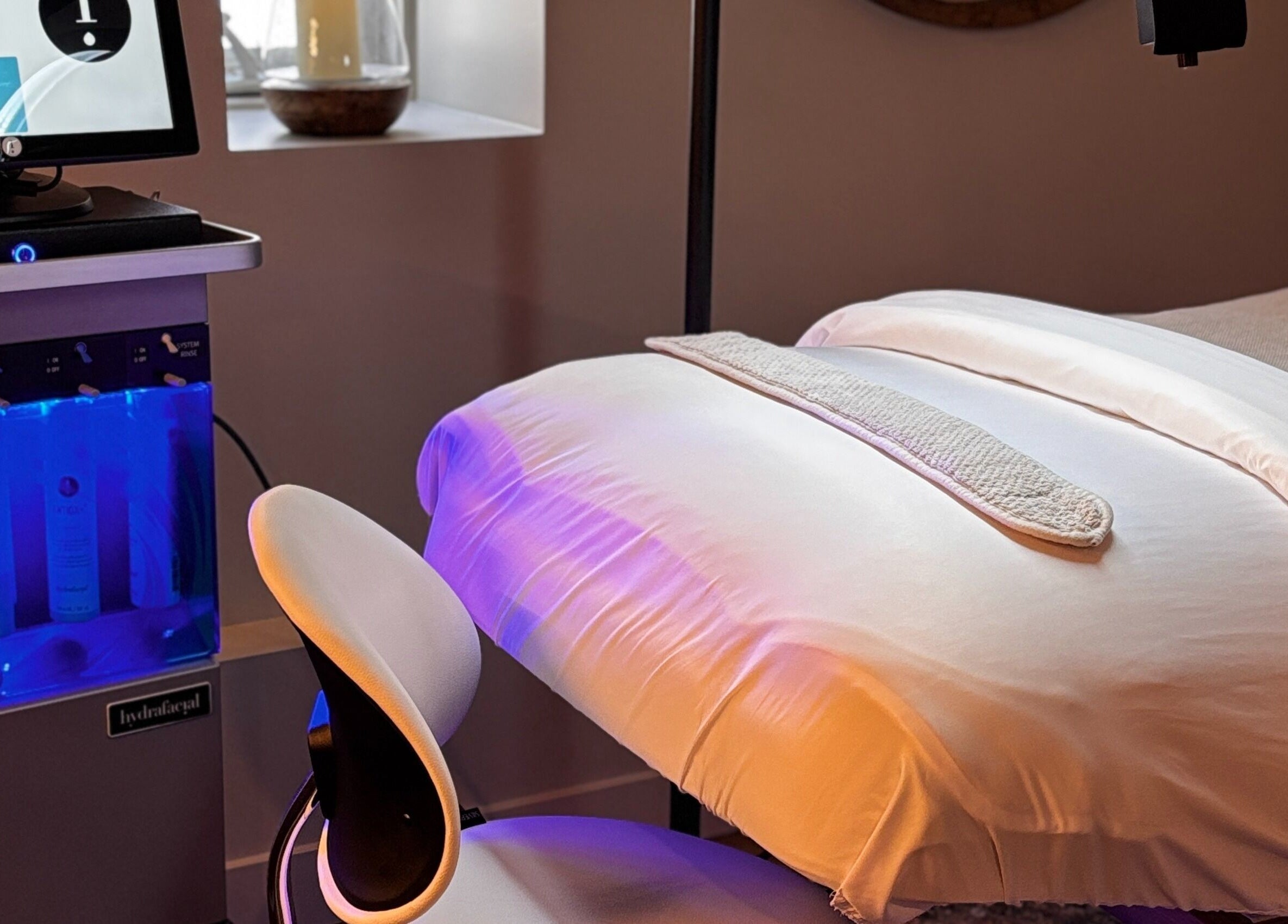 Relaxing spa treatment room at La Luma Spa & Aesthetics in Drumheller, Alberta, CA with a modern setup.