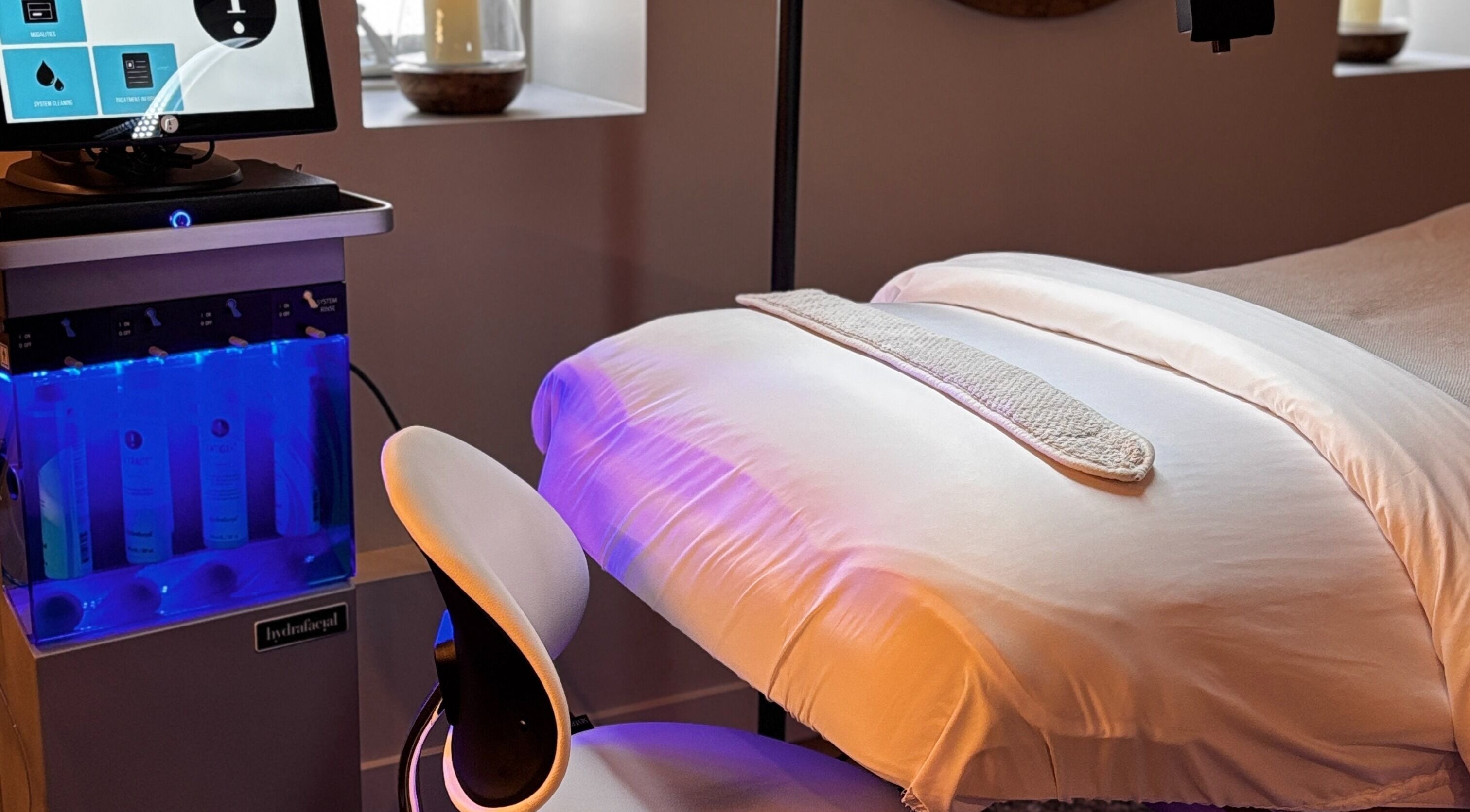 Relaxing spa treatment room at La Luma Spa & Aesthetics in Drumheller, Alberta, CA with a modern setup.