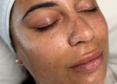 Relaxed woman with glowing skin at Megan Lou - Wellness | Skin | Eyebrows, Leicester, England, GB.