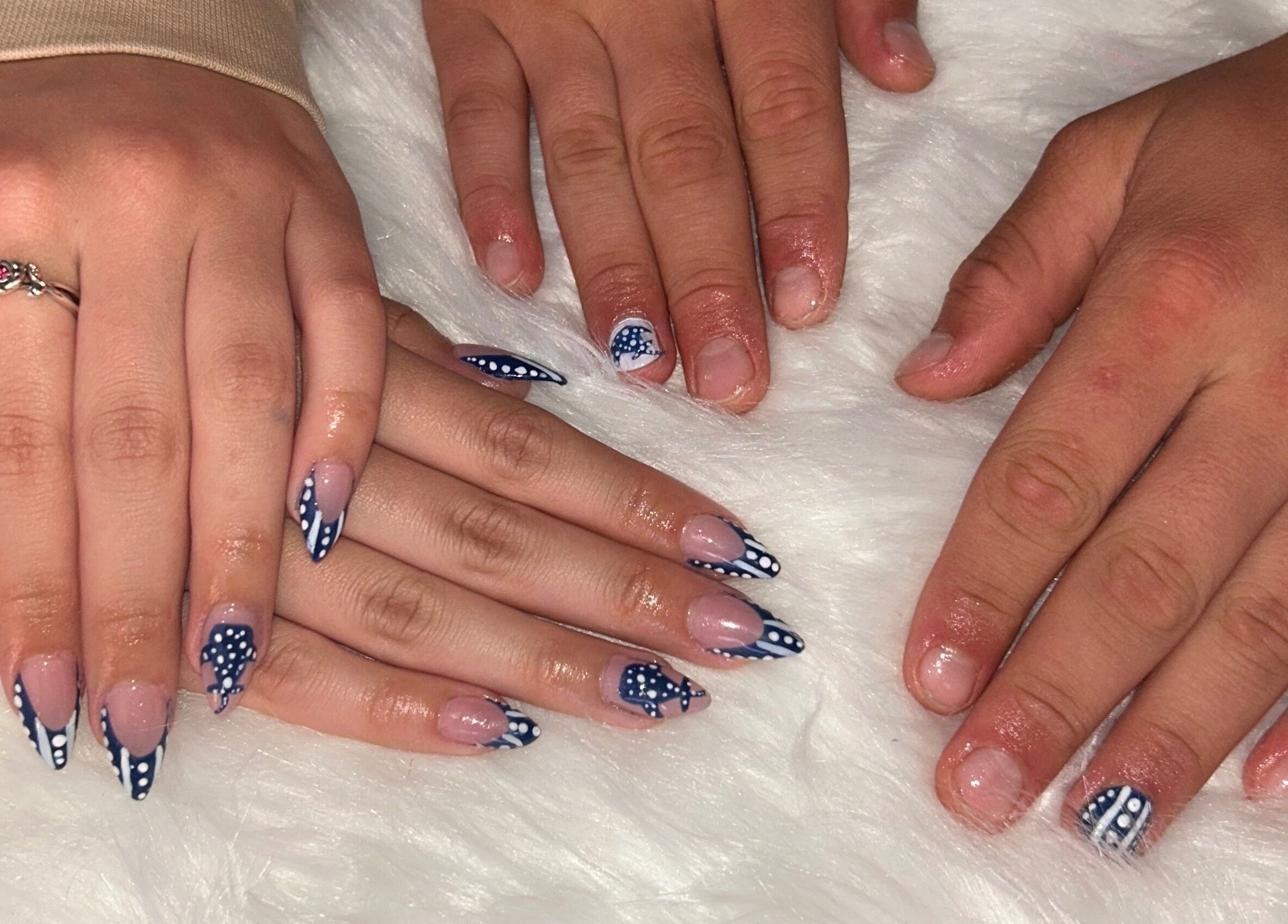 Polished nails with navy and white dot designs at Nailss.ByKeira, Ottawa, Ontario, CA.