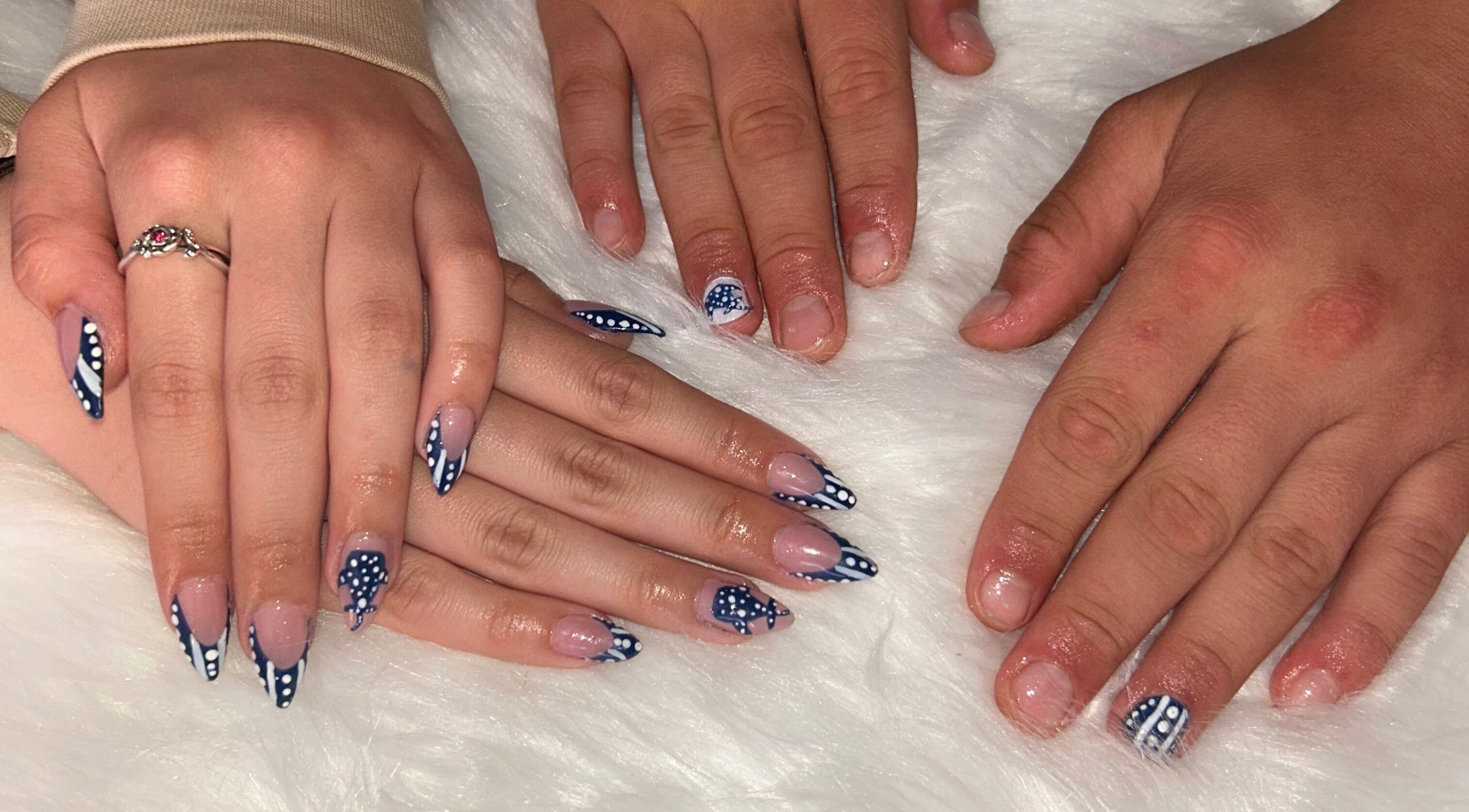 Polished nails with navy and white dot designs at Nailss.ByKeira, Ottawa, Ontario, CA.