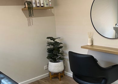 Modern salon chair and mirror setup at Sanctum Hair Studio, Mandurah, Western Australia, AU.