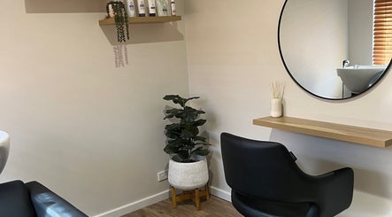 Modern salon chair and mirror setup at Sanctum Hair Studio, Mandurah, Western Australia, AU.