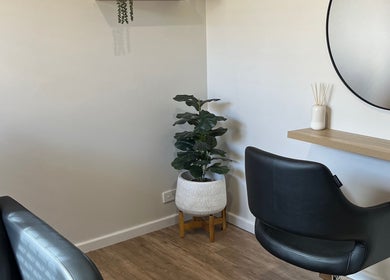 Chic styling area at Sanctum Hair Studio in Mandurah, Western Australia, AU featuring minimalist decor.