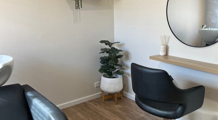 Chic styling area at Sanctum Hair Studio in Mandurah, Western Australia, AU featuring minimalist decor.