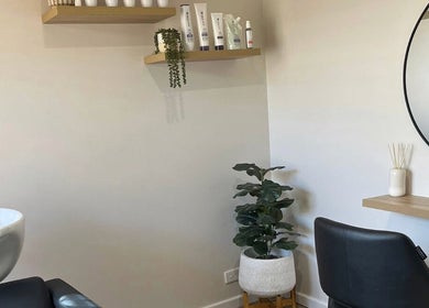 Chic interior of Sanctum Hair Studio, Mandurah, Western Australia, AU with modern washbasin and stylish decor.