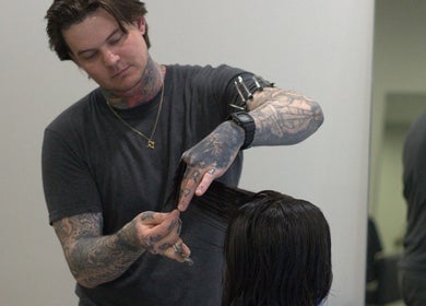 Stylist cutting hair at Sanctum Studio Perth, Subiaco, Western Australia, AU.