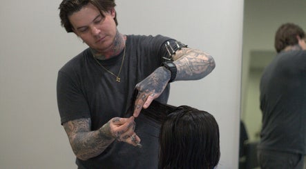 Stylist cutting hair at Sanctum Studio Perth, Subiaco, Western Australia, AU.