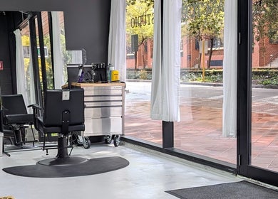 Modern salon interior at Sanctum Studio Perth, Subiaco, Western Australia, AU, showcasing sleek styling chairs.