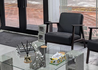 Cozy waiting area at Sanctum Studio Perth, Subiaco, Western Australia, AU with stylish black chairs and modern decor.
