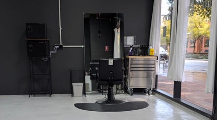 Chic salon chair at Sanctum Studio Perth in Subiaco, Western Australia, AU with floor-to-ceiling windows.