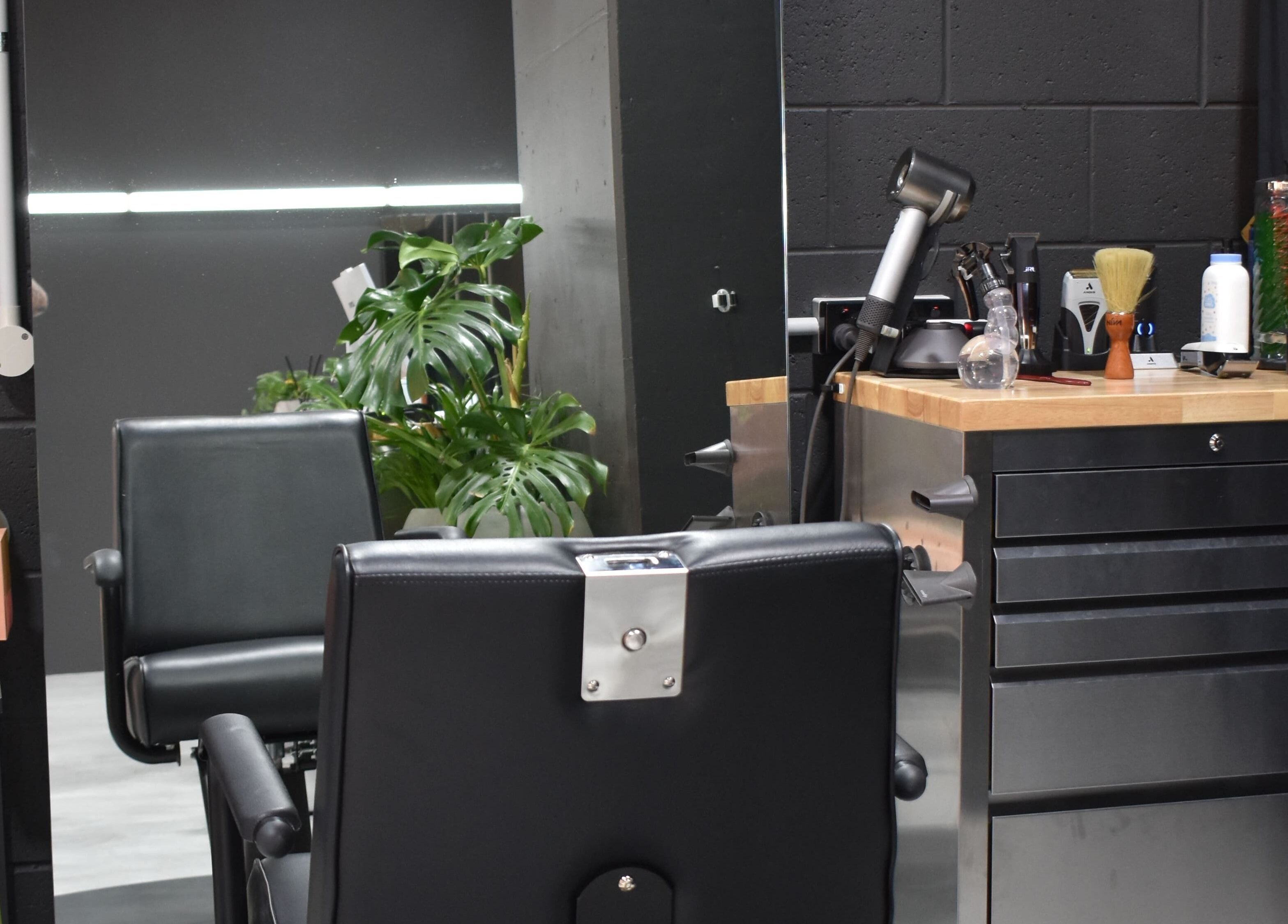 A modern salon chair and styling station at Sanctum Studio Perth in Subiaco, Western Australia, AU.