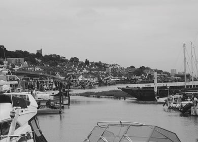 Scenic harbor view near Wave Barber Studio, Southend-on-sea, England, GB with boats and coastal town.