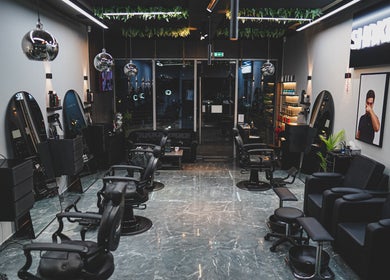Modern beauty salon interior at Shaker & Co, Dubai, Dubai, AE showcasing luxury black furnishings.