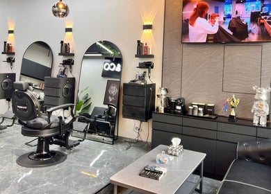 Modern salon interior at Shaker & Co, Dubai, Dubai, AE, featuring chic mirrors and comfortable styling chairs.