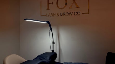 Relaxing treatment space at Fox Lash & Brow Co, Barry, Wales, GB, featuring a modern lamp.