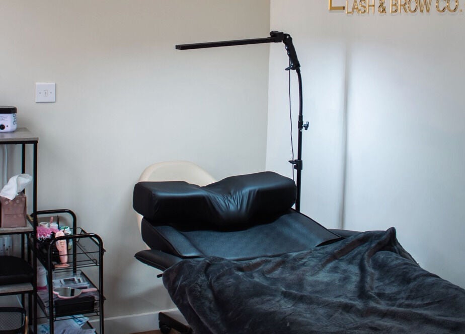 Comfortable treatment room at Fox Lash & Brow Co in Barry, Wales, GB, featuring a black reclining chair.