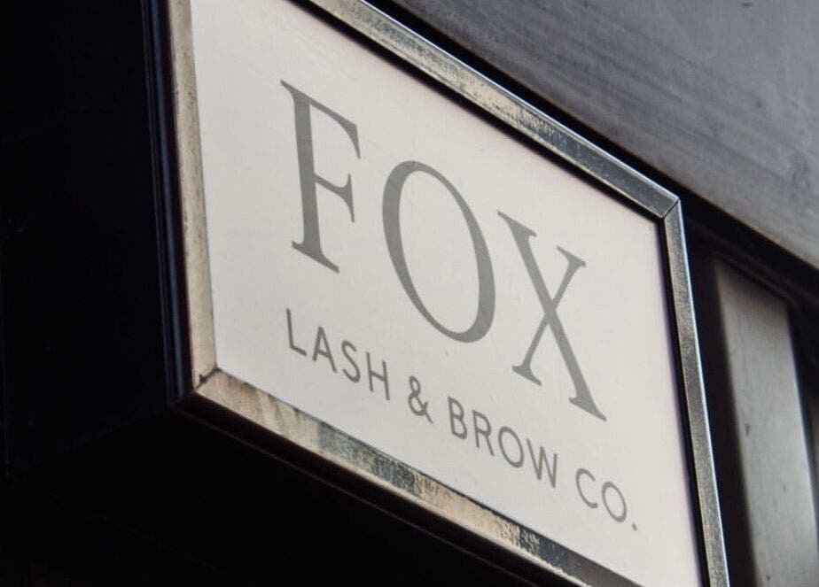Shopfront sign of Fox Lash & Brow Co in Barry, Wales, GB, displaying elegant typography.