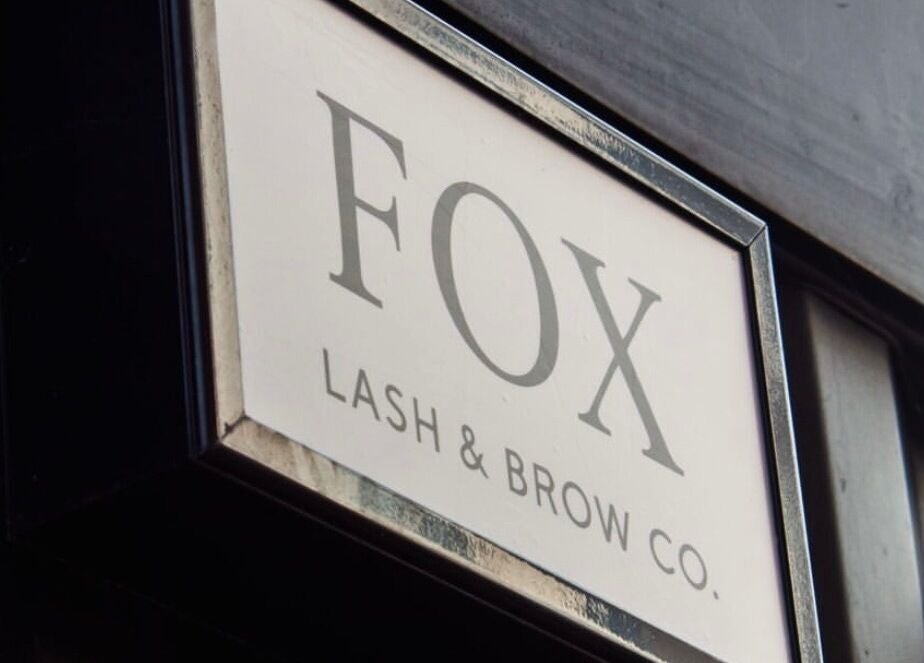 Shopfront sign of Fox Lash & Brow Co in Barry, Wales, GB, displaying elegant typography.