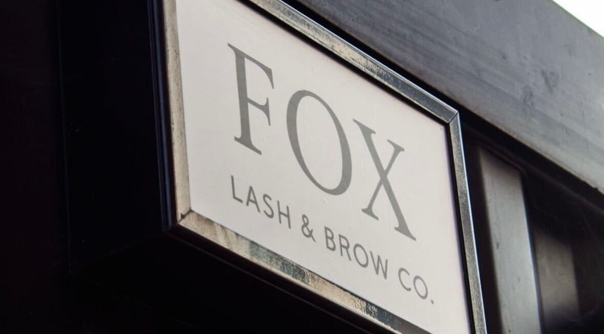 Shopfront sign of Fox Lash & Brow Co in Barry, Wales, GB, displaying elegant typography.