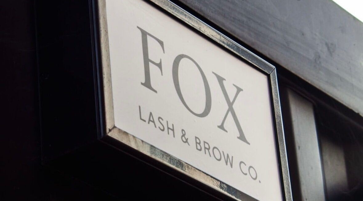 Shopfront sign of Fox Lash & Brow Co in Barry, Wales, GB, displaying elegant typography.